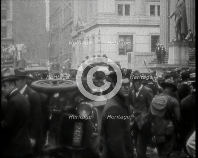 Police Looking Over Overturned Vehicles in New York City After a Bomb Was Thrown at the..., 1920. Creator: British Pathe Ltd.
