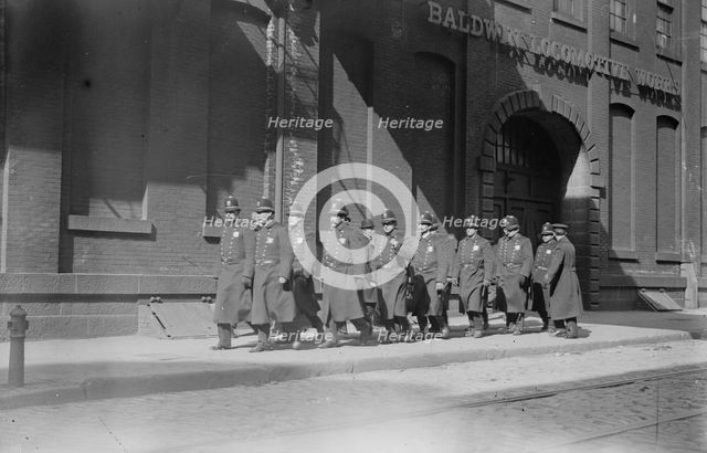 Police patrol marching outside Baldwin Locomotive Works, Philadelphia, 1910. Creator: Bain News Service.