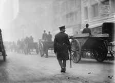 Police protecting garbage carts, 1911. Creator: Bain News Service