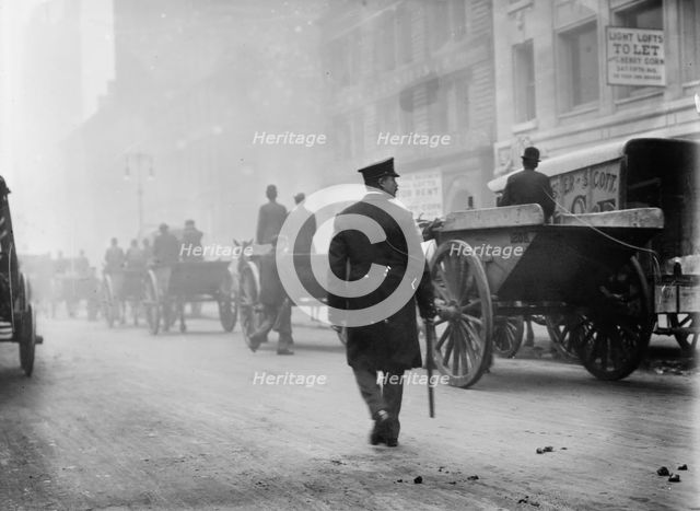Police protecting garbage carts, 1911. Creator: Bain News Service.