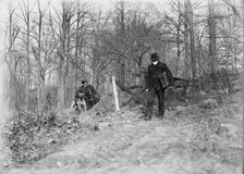 Policeman, police dog, waiting for thief, New York City, 1912. Creator: Bain News Service