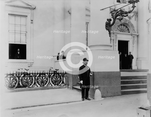 Policeman standing guard at entrance to White House, between 1889 and 1906. Creator: Frances Benjamin Johnston.