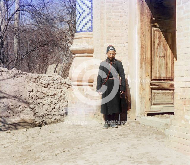 Policeman standing in front of doorway, between 1905 and 1915. Creator: Sergey Mikhaylovich Prokudin-Gorsky.