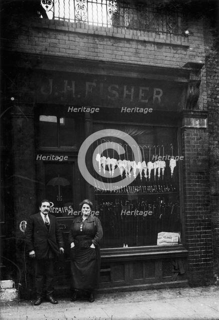 Polish Jews outside their umbrella shop in Hackney, London, c1910. Creator: Unknown.