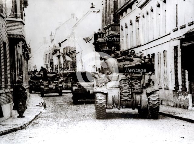 Polish tanks advance through the town of Tielt, Belgium, c1944. Artist: Unknown