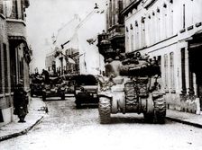 Polish tanks advance through the town of Tielt, Belgium, c1944