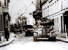 Polish tanks advance through the town of Tielt, Belgium, c1944. Creator: Unknown
