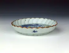 Polychrome saucer dish with cow and donkey, late Ming dynasty, Chongzhen period, China, 1630-1644. Creator: Unknown