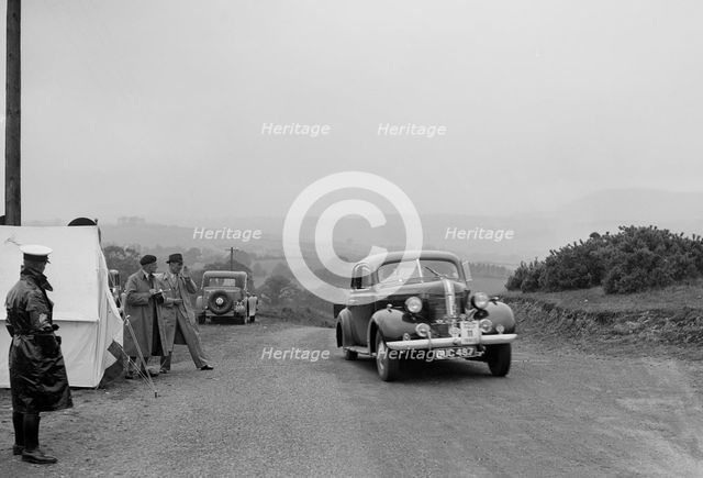 Pontiac saloon of J Owen-Smith competing in the South Wales Auto Club Welsh Rally, 1937 Artist: Bill Brunell.