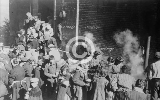 Poor in North France fed from German field kitchen, between c1914 and c1915. Creator: Bain News Service.