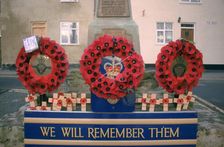 Poppy wreaths on a war memorial, West Yorkshire. Artist: Dorothy Burrows
