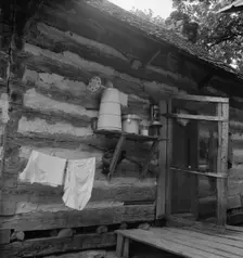 Porch on Negro share tenant cabin, near Gordonton, North Carolina, 1939. Creator: Dorothea Lange