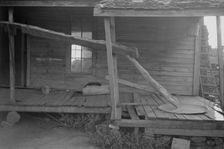Porch of a sharecropper's cabin, Hale County, Alabama, 1936. Creator: Walker Evans