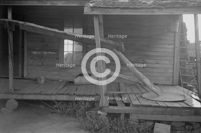 Porch of a sharecropper's cabin, Hale County, Alabama, 1936. Creator: Walker Evans.