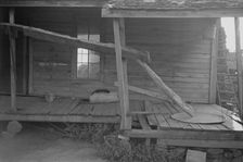 Porch of a sharecropper's cabin, Hale County, Alabama, 1936. Creator: Walker Evans