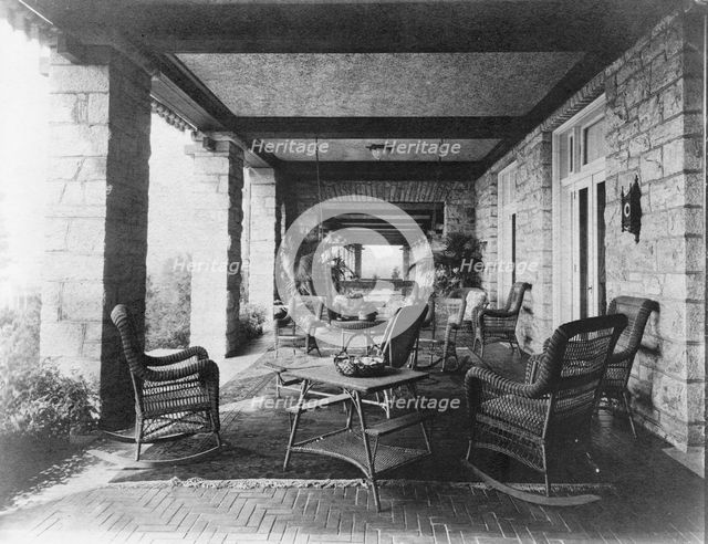 Porch of E.C. Converse house, with wicker furniture, Greenwich, Connecticut, 1908. Creator: Frances Benjamin Johnston.