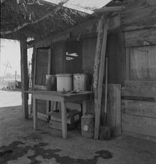 Porch of Mexican worker's home in East El Centro, Imperial Valley, California, 1937. Creator: Dorothea Lange