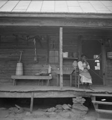 Porch of Negro tenant house, showing household equipment, Person County, North Carolina, 1939. Creator: Dorothea Lange