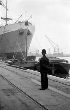 Port of London Authority policeman on patrol, c1945-c1965. Artist: SW Rawlings