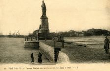 Port Said. - Lesseps Statue and entrance to the Suez Canal - LL. c1918-c1939. Creator: Unknown