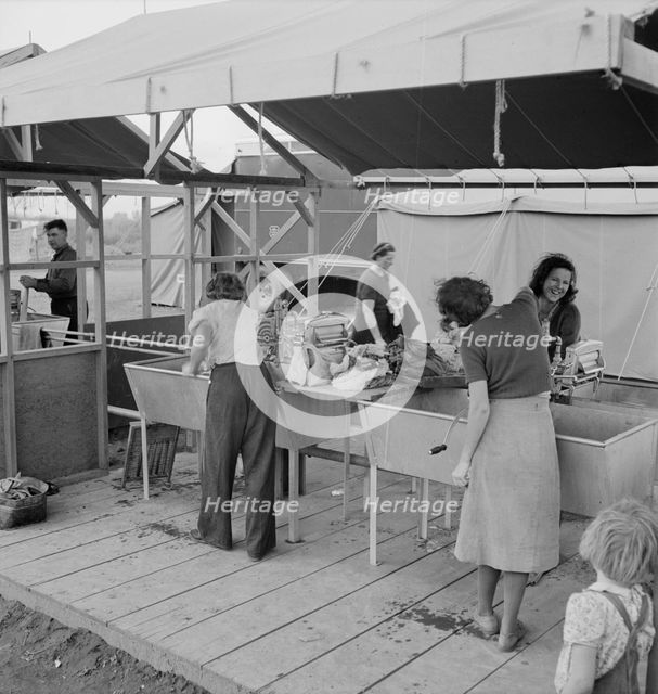 Portable laundry unit, shower unit beyond, FSA camp, Merrill, Oregon, 1939. Creator: Dorothea Lange.