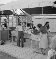 Portable laundry unit, shower unit beyond, FSA camp, Merrill, Oregon, 1939. Creator: Dorothea Lange