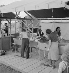 Portable laundry unit, shower unit beyond, FSA camp, Merrill, Oregon, 1939. Creator: Dorothea Lange