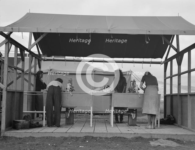 Portable laundry unit, shower unit beyond, FSA camp, Merrill, Oregon, 1939. Creator: Dorothea Lange.