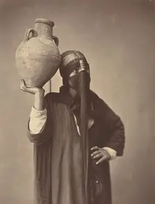 Porteuse d'eau au Caire [Water Carrier in Cairo], c. 1870. Creator: Felix Bonfils