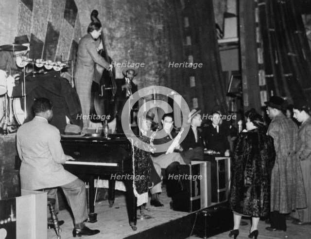Portrait of Count Basie, Ray Bauduc, Bob Haggart, Harry Edison, Herschel Evans...Washington, c1941. Creator: William Paul Gottlieb.