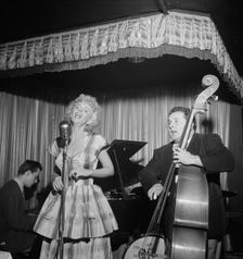 Portrait of Chubby Jackson and Dottie Reid, Onyx, New York, N.Y., ca. July 1947. Creator: William Paul Gottlieb