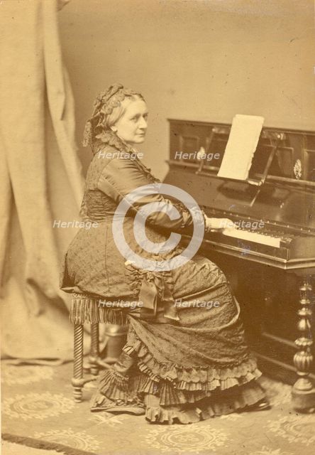 Portrait of Clara Wieck-Schumann (1819-1896) at the piano, ca 1878. Creator: Hanfstaengl, Franz (1804-1877).
