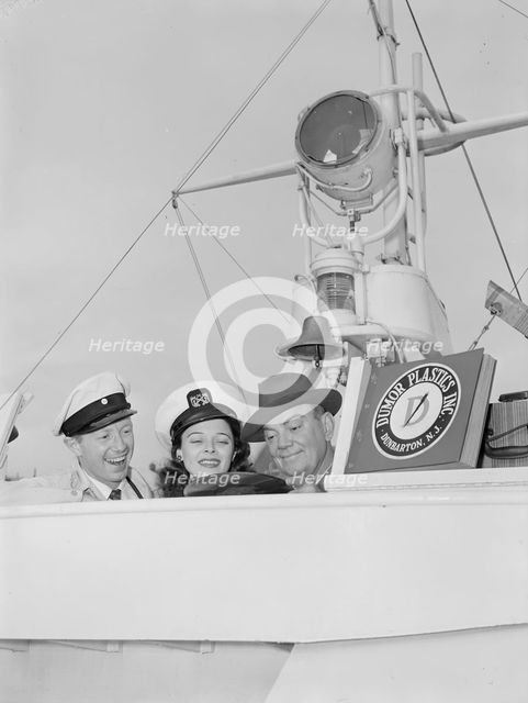 Portrait of Cliff Edwards, Betty Brewer, and Frank...Ukelele Lady (yacht), Hudson River, N.Y., 1947. Creator: William Paul Gottlieb.