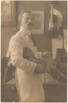 Portrait of a Violin Maker in Studio, 1895-1943. Creator: Louis Fleckenstein
