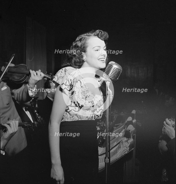 Portrait of a vocalist with Justin Stone's ensemble, 1938. Creator: William Paul Gottlieb.