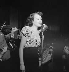 Portrait of a vocalist with Justin Stone's ensemble, 1938. Creator: William Paul Gottlieb