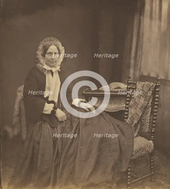 Portrait of a woman, wearing a bonnet, seated, 1850s. Creator: Roger Fenton.