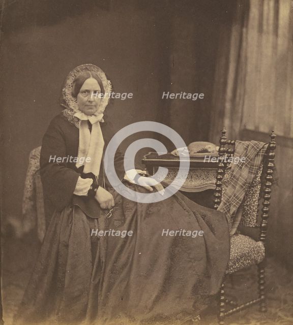 Portrait of a woman, wearing a bonnet, seated, 1850s. Creator: Roger Fenton.