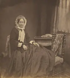 Portrait of a woman, wearing a bonnet, seated, 1850s. Creator: Roger Fenton