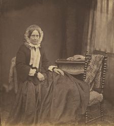 Portrait of a woman, wearing a bonnet, seated, 1850s. Creator: Roger Fenton