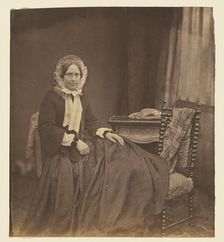 Portrait of a woman, wearing a bonnet, seated, 1850s. Creator: Roger Fenton