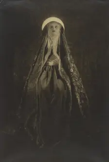 Portrait of a Woman Wearing a Long, Veiled Hat, about 1922. Creator: Francis Joseph Bruguiere
