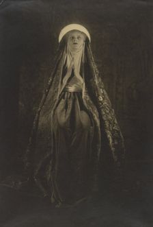 Portrait of a Woman Wearing a Long, Veiled Hat, about 1922. Creator: Francis Joseph Bruguiere