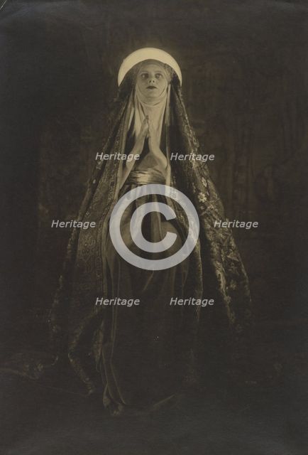 Portrait of a Woman Wearing a Long, Veiled Hat, about 1922. Creator: Francis Joseph Bruguiere.