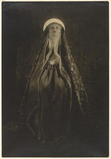 Portrait of a Woman Wearing a Long, Veiled Hat, about 1922. Creator: Francis Joseph Bruguiere