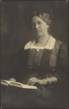 Portrait of a Woman with Open Book, 1907-1943. Creator: Louis Fleckenstein