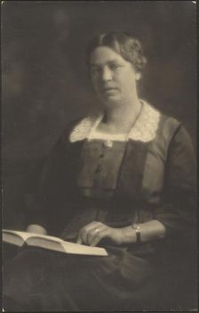 Portrait of a Woman with Open Book, 1907-1943. Creator: Louis Fleckenstein