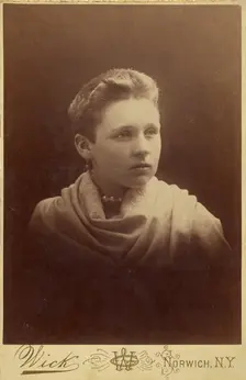 Portrait of a woman with extremely short hair, about 1890. Creator: G Wick