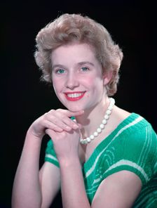 Portrait of a woman with green eyes, c1955. Creator: Arthur Charles Kirby Ware