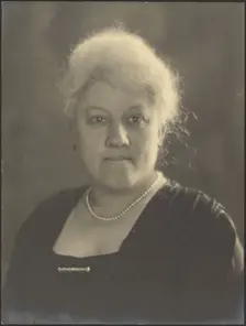 Portrait of a Woman with Pearls and Bar Pin, 1907-1924. Creator: Louis Fleckenstein